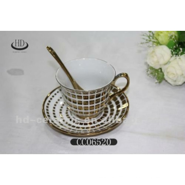 gold rim ceramic coffee cup and saucer